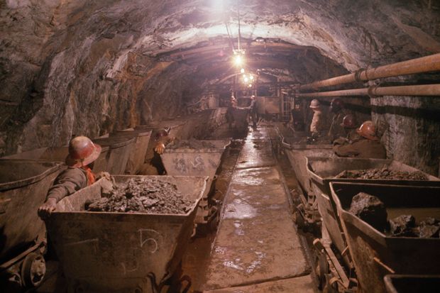 CONGO - SEPTEMBER 09: Miners push radioactive pitchblende, used in atomic bombs, in a shaft, Shinkolobwe, Republic of the Congo (Photo by Willis D. Vaughn/National Geographic/Getty Images)
